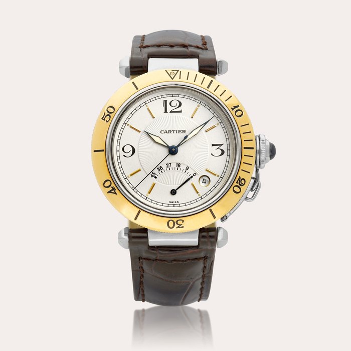 Cartier Pasha, Reference 1033 | A yellow gold and stainless steel wristwatch with date and power reserve indication, Circa 1990 | 卡地亞 | Pasha 型號1033 | 黃金及精鋼腕錶，備日期及動力儲備顯示，約1990年製