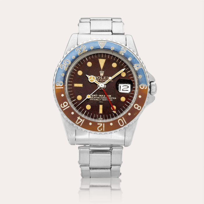 Rolex GMT-Master ‘Pepsi Tropical Underline PCG’, Reference 1675 | A stainless steel dual time wristwatch with date and bracelet, Circa 1964 | 勞力士 | GMT-Master ‘Pepsi Tropical Underline PCG’ 型號1675 | 精鋼兩地時間鏈帶腕錶，備日期顯示，約1964年製 · 1675