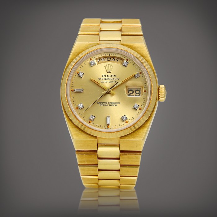 Rolex Oysterquartz Day-Date, Reference 19018 | A yellow gold and diamond-set wristwatch with day, date and bracelet, Circa 1980 | 勞力士 | Oysterquartz Day-Date 型號19018 | 黃金鑲鑽石鏈帶腕錶，備日期及星期顯示，約1980年製