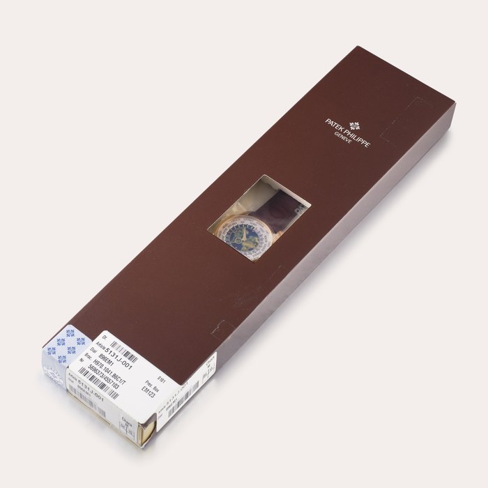 Patek Philippe Reference 5131 | A yellow gold world time wristwatch with cloisonné enamel dial, in double factory seal, Circa 2013