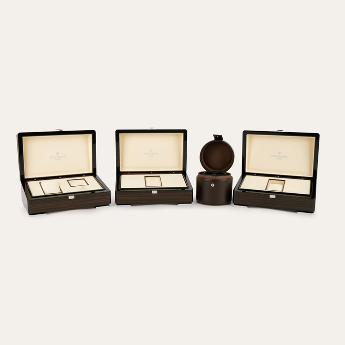 Patek Philippe A set of three presentation boxes and one winding cylinder, Circa 2010 to 2022