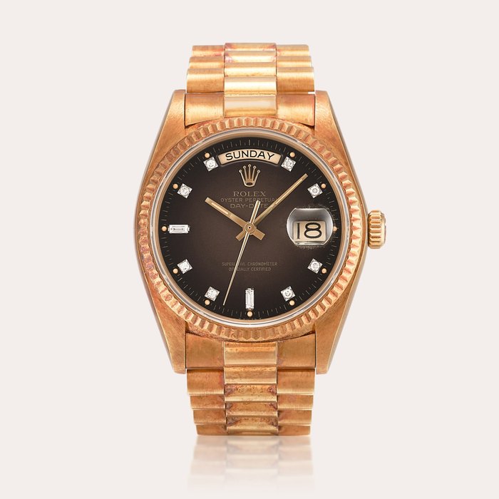 Rolex Day-Date "Stella", Reference 18038 | A yellow gold and diamond-set wristwatch with day, date, stella dial and bracelet, Circa 1982
