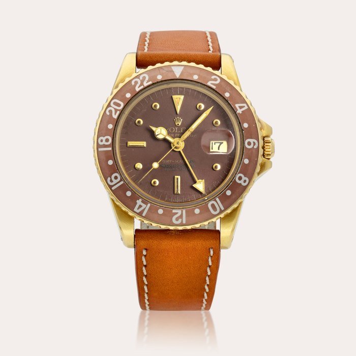 Rolex GMT-Master "Nipple Dial", Reference 1675 | A yellow gold dual time wristwatch with date, Circa 1970 · 1675