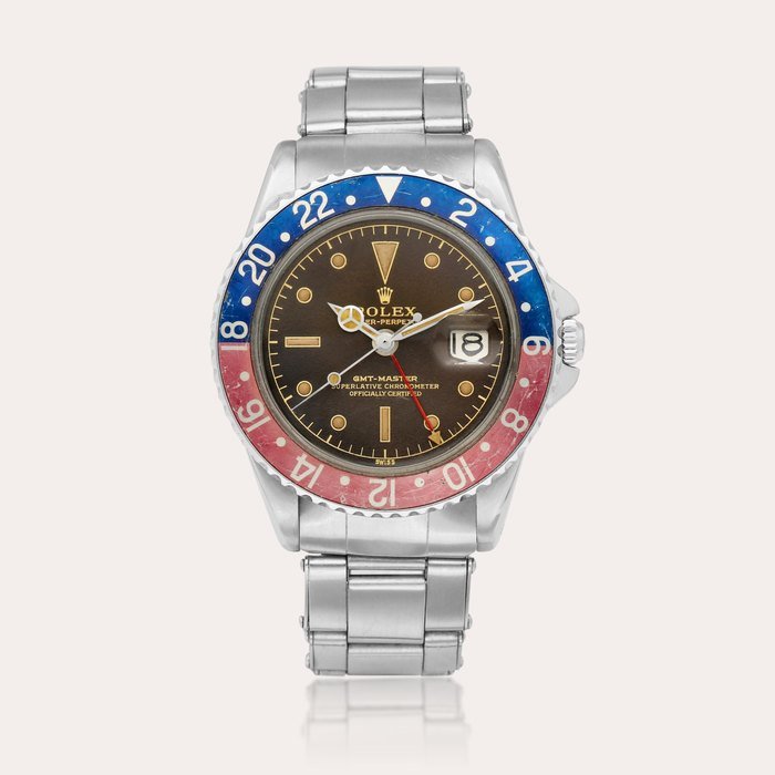 Rolex GMT-Master ‘Pepsi Tropical Eagle Beak’, Reference 1675 | A stainless steel dual time wristwatch with date and bracelet, Circa 1960 · 1675