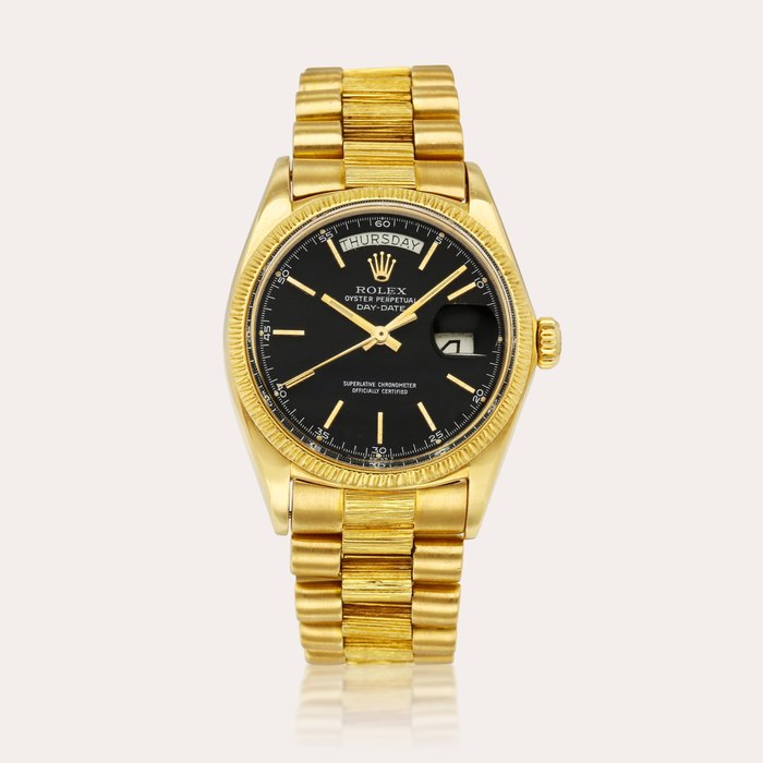 Rolex Day-Date, Reference 1807 | A yellow gold wristwatch with day, date and bracelet, Circa 1973