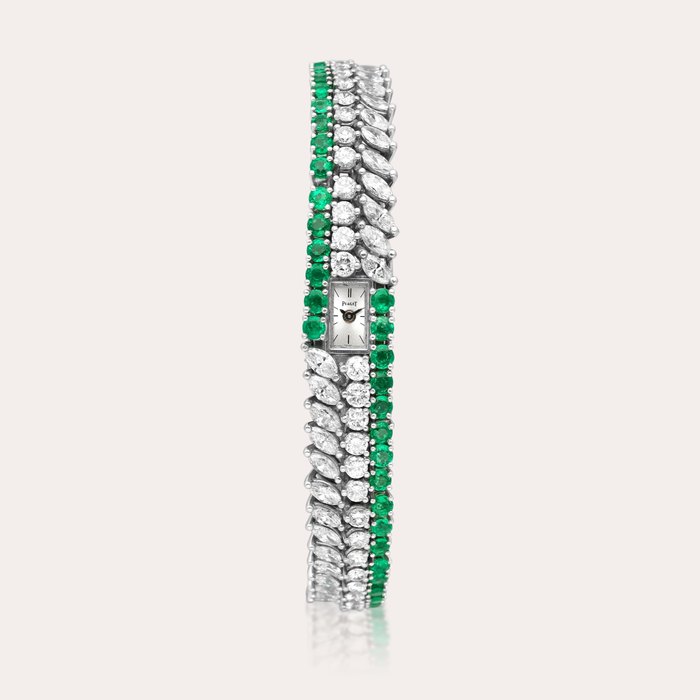 Piaget Reference 1376 | A platinum, diamond and emerald-set bracelet watch, Circa 1970