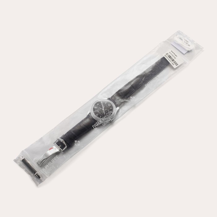 Patek Philippe Reference 5147 | A white gold and diamond-set annual calendar wristwatch with moon phases and power reserve indication, In single factory seal, Circa 2006
