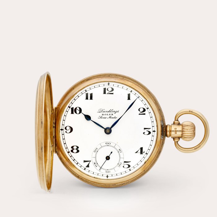 Rolex A pink gold hunting case keyless lever watch with enamel dial, Retailed by Dunklings, Circa 1930