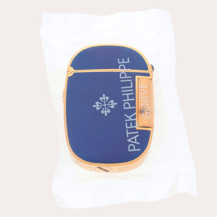 Patek Philippe Golden Ellipse, Reference 9507 | A service sealed yellow gold and blue enamel lighter | Circa 1980