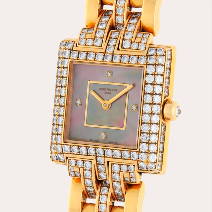 Patek Philippe Reference 4874/2 | A yellow gold and diamond-set bracelet watch with mother-of-pearl dial | Circa 2006