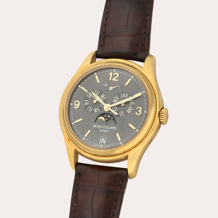Patek Philippe Reference 5146J | A yellow gold annual calendar wristwatch with moon phases and power reserve indication | Circa 2010