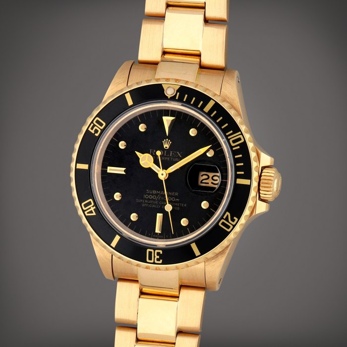 Rolex Submariner 'Nipple Dial', Reference 16808 | A yellow gold wristwatch with date and bracelet | Circa 1986