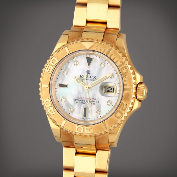 Rolex Yacht-Master, Reference 16628B | A yellow gold, diamond and sapphire-set wristwatch with date, mother-of-pearl dial and bracelet | Circa 2006