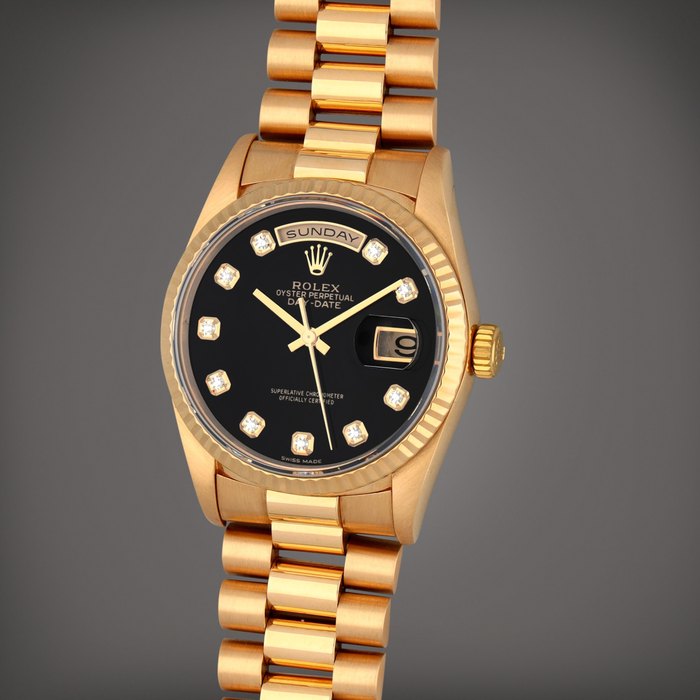 Rolex Day-Date, Reference 18238 | A yellow gold wristwatch with diamond-set onyx dial,901274531 day, date and bracelet | Circa 1996