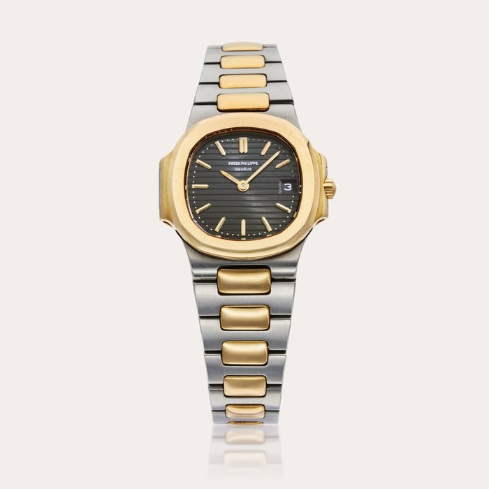 Patek Philippe Reference 4700/011 Nautilus | A stainless steel and yellow gold wristwatch with date and bracelet, Circa 1987