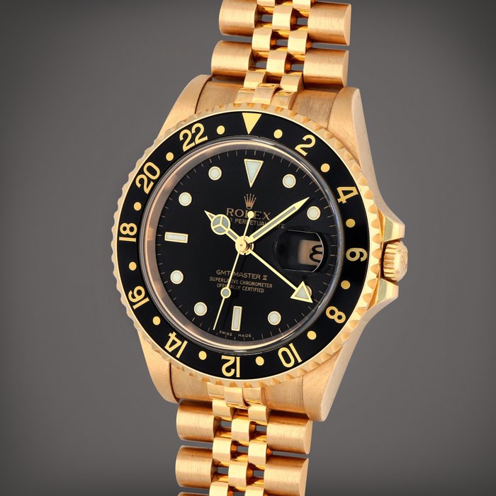 Rolex GMT-Master II, Reference 16718T | A yellow gold dual time zone wristwatch with date and bracelet | Circa 2003, Price & Market Data