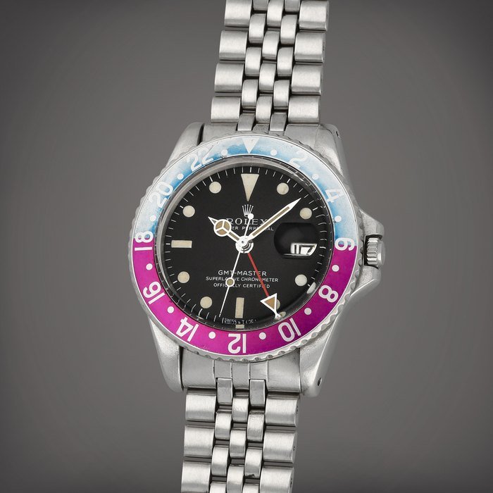 Rolex 'Fuchsia' GMT-Master, Reference 1675 | A stainless steel dual time wristwatch with date and bracelet | Circa 1969 · 1675