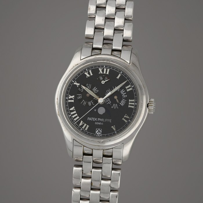 Patek Philippe Reference 5036/1G-013 | A white gold annual calendar wristwatch with moon phases, power reserve indication and bracelet | Circa 2006