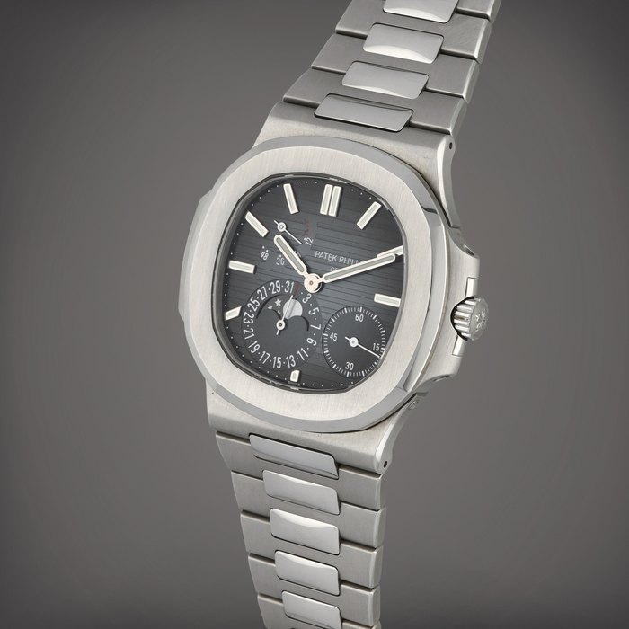 Patek Philippe Nautilus, Reference 5712/1A-001 | A stainless steel wristwatch with date, moon phases, power reserve indication and bracelet | Circa 2019
