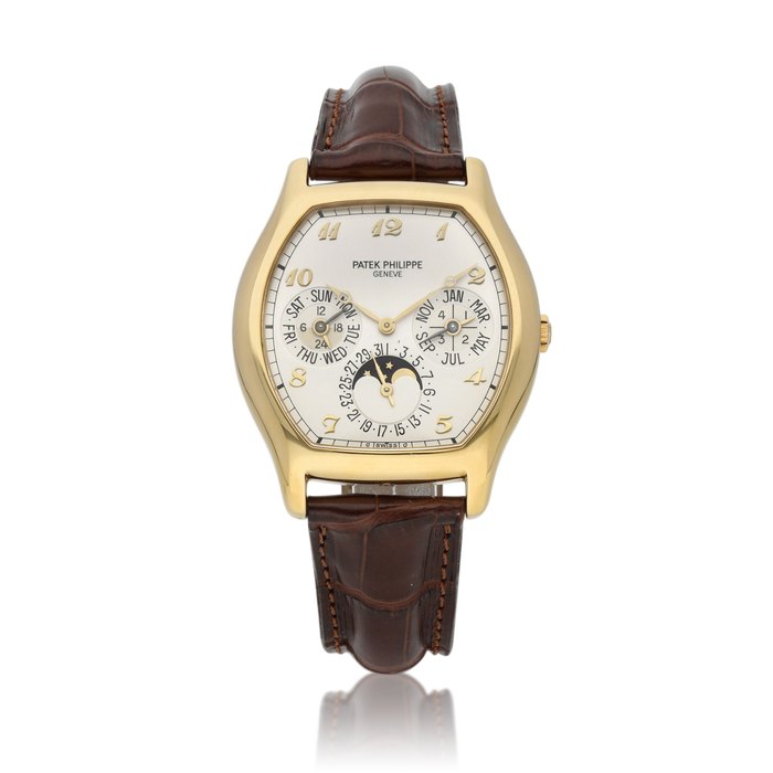 Patek Philippe Ref. 5040 | A yellow gold tonneau-shaped perpetual calendar wristwatch with moon phases and 24-hour indication | Circa 1997 · 5040