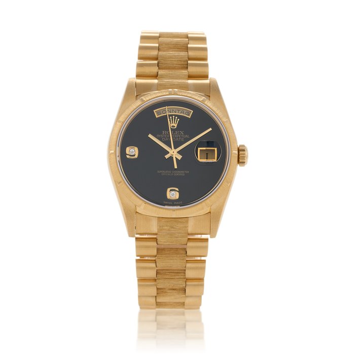 Rolex Day-Date, Ref. 18248  Yellow gold wristwatch with day, date, bracelet with bark finish and diamond-set onyx dial  Circa 1995 · 18248