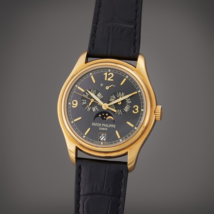 Patek Philippe Reference 5146J-010 | A yellow gold automatic annual calendar wristwatch with moon phases and power reserve indication, Circa 2010