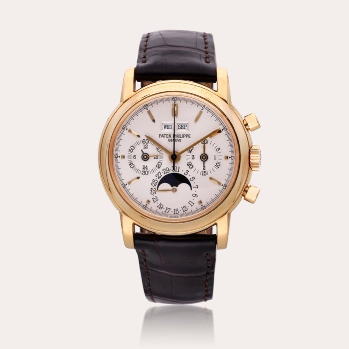 Patek Philippe Reference 3970 E ‘Third Series’ | A yellow gold perpetual calendar chronograph wristwatch with moon phases, leap year, and 24 hour indication, Made in 1994 · 3970