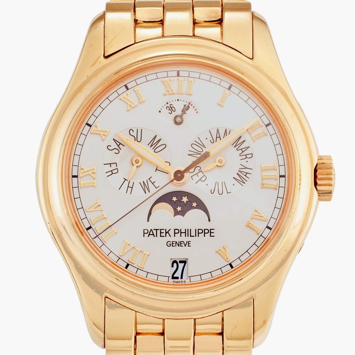 Patek Philippe Reference 5036/1 | A pink gold automatic annual calendar wristwatch with moon phases, power reserve indication, and bracelet, Circa 2001