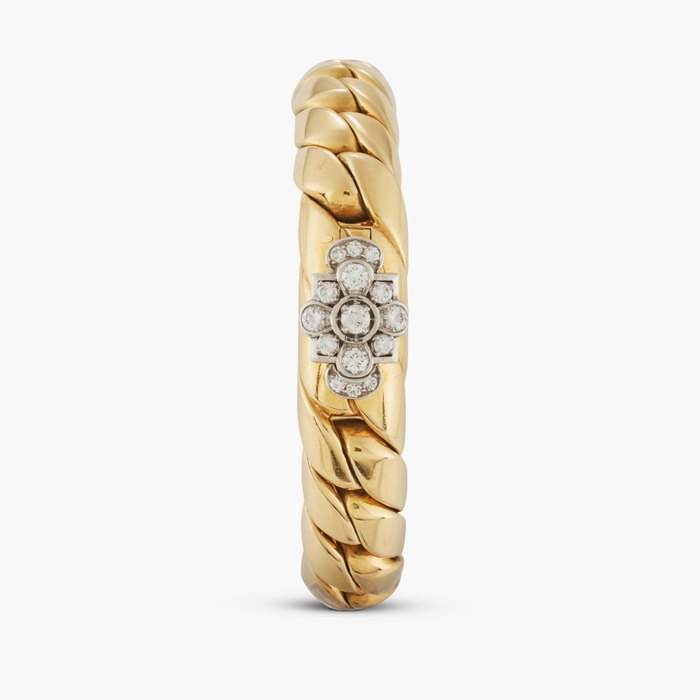 Cartier, New York A yellow gold and diamond-set concealed dial bracelet watch, Circa 1940s