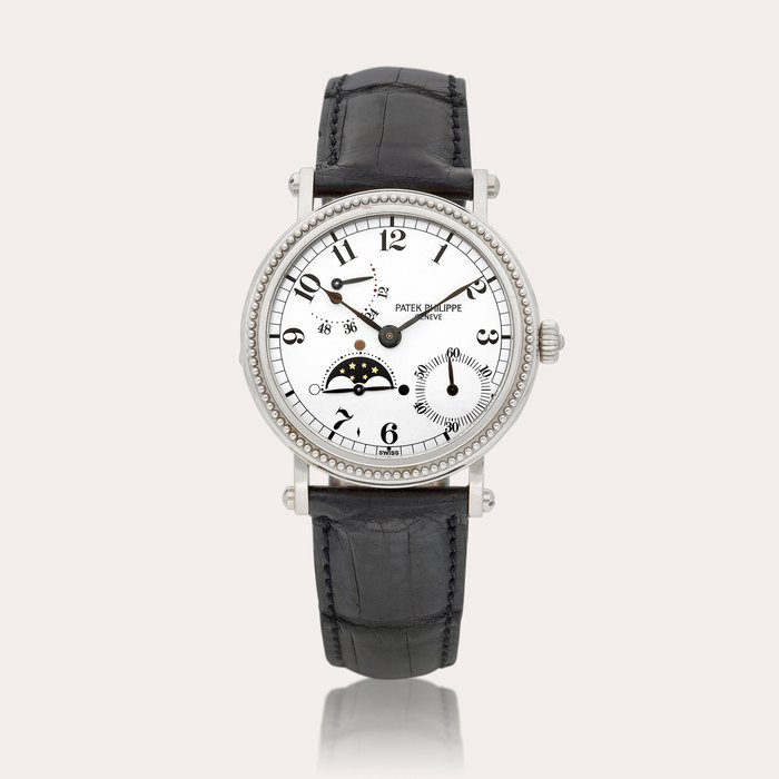 Patek Philippe Reference 5015 A white gold wristwatch with moon phases and power reserve indication, Circa 1996 | 百達翡麗 | 型號5015 | 白金腕錶，備月相及動力儲備顯示，約1996年製 · 5015