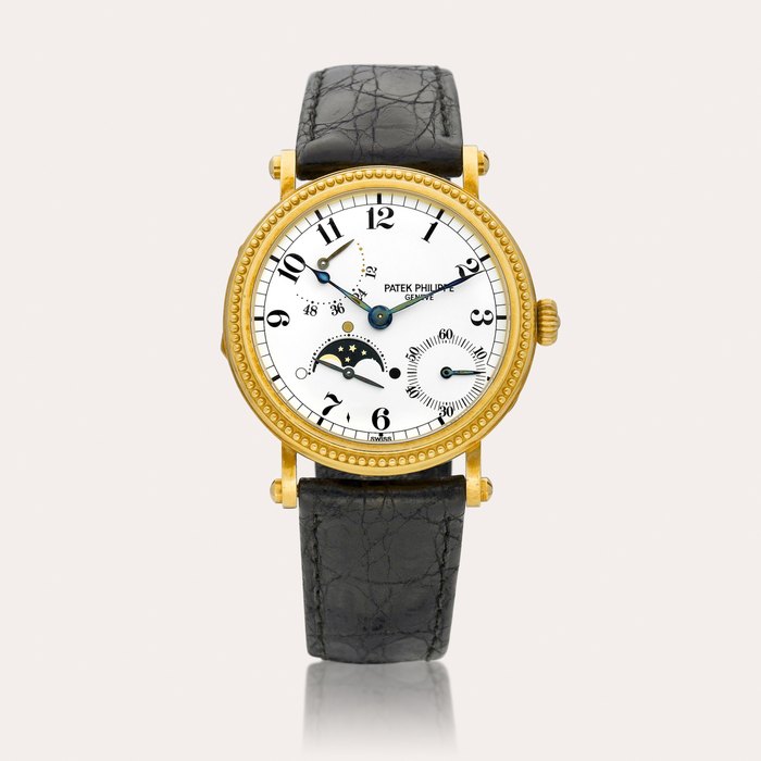 Patek Philippe Reference 5015 | A yellow gold wristwatch with moon phases and power reserve indication, Made in 1994 | 百達翡麗 | 型號5015 | 黃金腕錶，備月相及動力儲備顯示，1994年製 · 5015