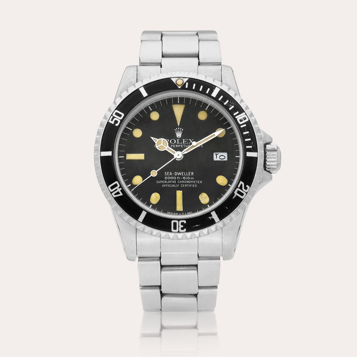 Rolex Sea-Dweller "Great White", Reference 1665 | A stainless steel wristwatch with Arabic date and bracelet, Circa 1978 | 勞力士 | Sea-Dweller "Great White" 型號1665 | 精鋼鏈帶腕錶，備阿拉伯日期，約1978年製 · 1665