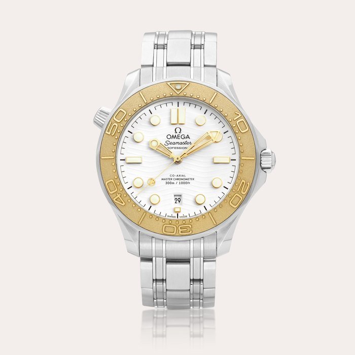 Omega Seamaster Diver "Paris Olympics 2024", Reference 522.21.42.20.04.001 | A stainless steel wristwatch with date, bracelet and Moonshine Gold bezel, Circa 2024 | 歐米茄 | 海馬潛水系列 “巴黎奧運 2024” 型號522.21.42.20.04.001 | 精鋼鏈帶腕錶，備日期顯示及 Moonshine 金錶圈，約2024年製 · 522.21.42.20.04.001