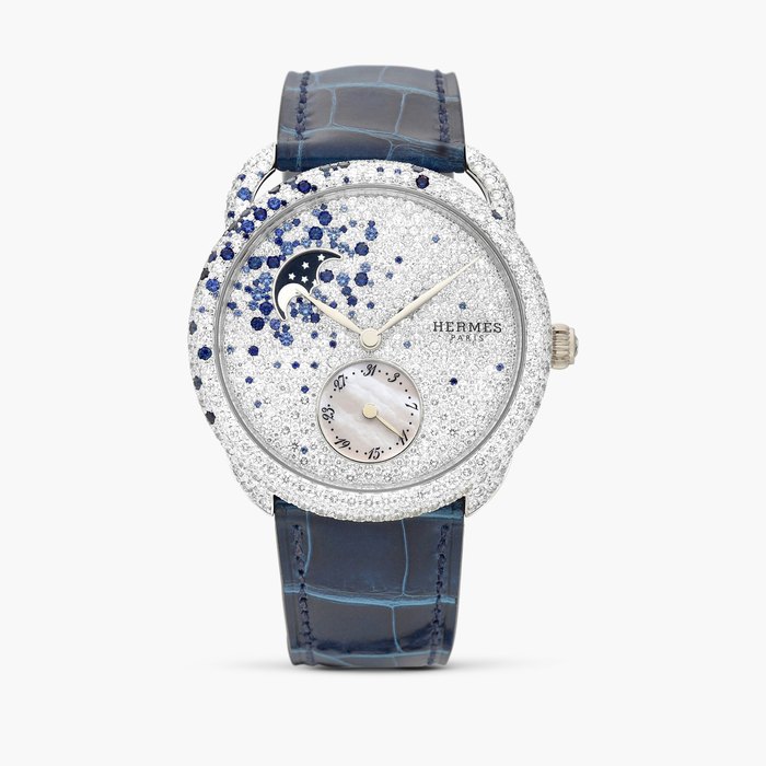 Hermès Arceau, Reference AR7.D91 | A white gold, diamond and sapphire-set wristwatch with mother-of-pearl date and moon phases, Circa 2024 · AR7.D91