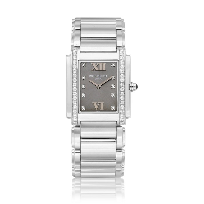 Patek Philippe Twenty~4, Reference 4910/10A | A stainless steel and diamond-set wristwatch with bracelet, Circa 2000 | 百達翡麗 | Twenty~4 型號4910/10A | 精鋼鑲鑽石鏈帶腕錶，約2000年製 · 4910/10A
