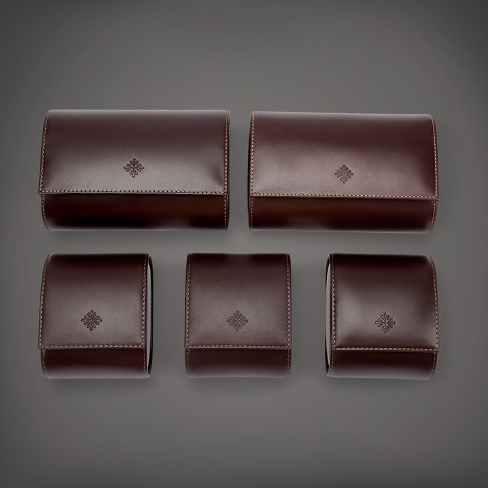 Patek Philippe A set of two leather travelling cases and three leather travelling pouches, Circa 2018 | 百達翡麗 | 一套兩件皮製旅行盒子及三件皮製旅行袋子，約2018年製