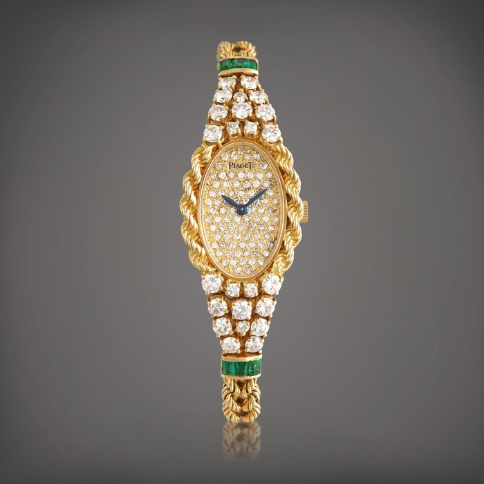 Piaget Reference 4566 |  A yellow gold, diamond and emerald-set bracelet watch, Circa 1990 |  伯爵 |  型號4566  |  黃金鑲鑽石及綠寶石鏈帶腕錶，約1990年製 · 4566