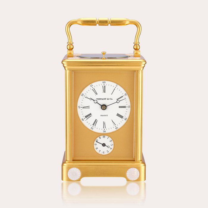 Tiffany & Co. A gilt brass and porcelain hour striking carriage clock with alarm, circa 1980