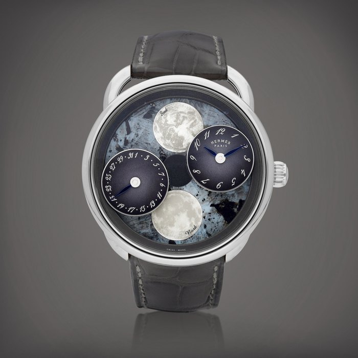 Hermès Arceau L' Heure de la Lune, Reference AR1.890f | A white gold wristwatch with date, moon phases and mother-of-pearl dial, Circa 2022 | 愛馬仕 | Arceau L' Heure de la Lune 型號AR1.890f | 白金腕錶，備日期、月相顯示及珠母貝錶盤，約2022年製 · AR1.890F