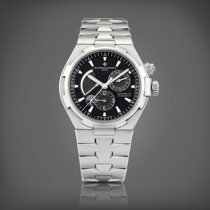Vacheron Constantin Overseas Dual Time, Reference 47450 | A stainless steel anti-magnetic dual time zone wristwatch with date, power reserve, day and night indication and bracelet, Circa 2010 | 江詩丹頓 | Overseas Dual Time 型號47450 | 精鋼防磁兩地時間鏈帶腕錶，備日期、動力儲備及晝夜顯示，約2010年製 · 47450