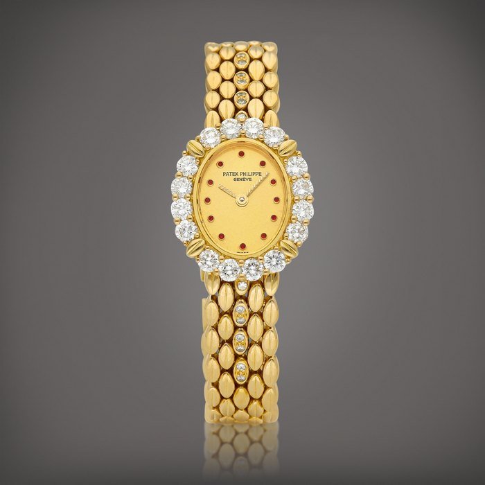 Patek Philippe Reference 4754 | A yellow gold, diamond and ruby-set bracelet watch, Circa 1985 | 百達翡麗 | 型號4754 | 黃金鑲鑽石及紅寶石鏈帶腕錶，約1985年製 · 4754