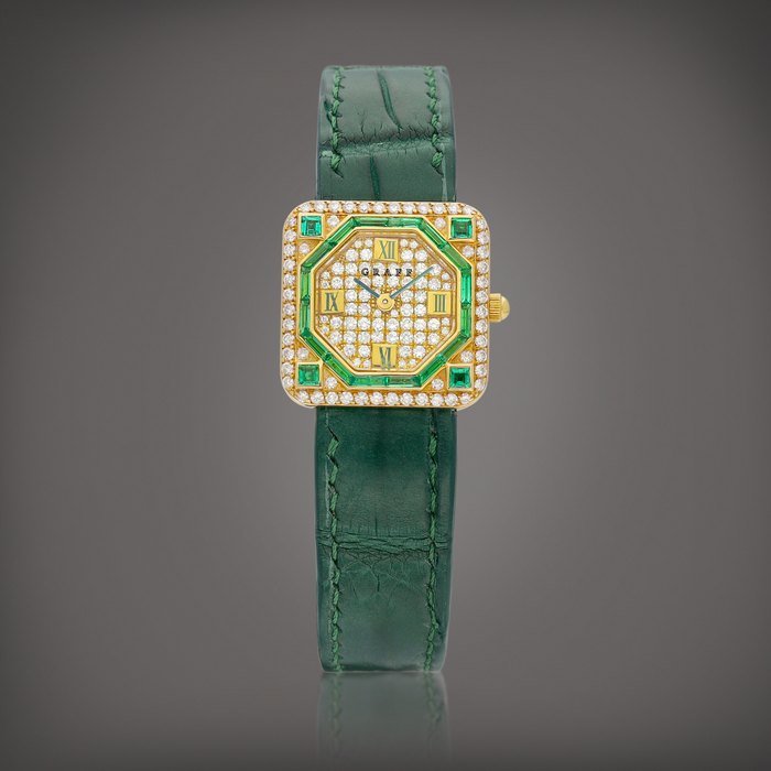 Graff A yellow gold, diamond and emerald-set wristwatch, Circa 1990 | 黃金鑲鑽石及綠寶石腕錶，約1990年製