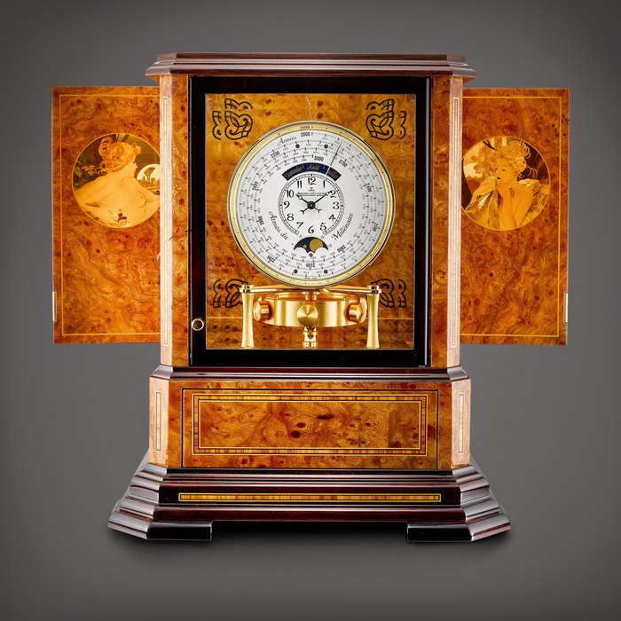 Jaeger-LeCoultre Atmos du Millénaire Marqueterie, Reference 5523101 | A marquetry wood cased gilt metal timepiece with 1000 year calendar and moon phases, Circa 2008 | 積家 | Atmos du Millénaire Marqueterie 型號5523101 | 細木雕嵌鍍金時計，備千年曆及月相，約2008年製 · 5523101