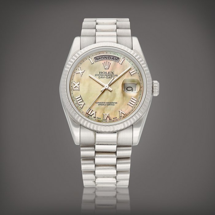 Rolex Day-Date, Reference 118239 | A white gold wristwatch with day, date, mother-of-pearl dial and bracelet, Circa 2000 | 勞力士 | Day-Date 型號118239 | 白金鏈帶腕錶，備日期、星期顯示及珠母貝錶盤，約2000年製 · 118239