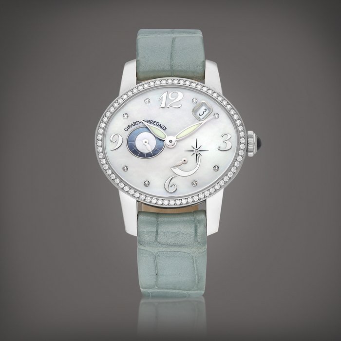 Girard-Perregaux Cat's Eye, Reference 80480 | A white gold and diamond-set wristwatch with date, power reserve indication and mother-of-pearl dial, Circa 2012 | 芝柏 | 貓眼系列 型號80480 | 白金鑲鑽石腕錶，備日期、動力儲備顯示及珠母貝錶盤，約2012年製 · 80480