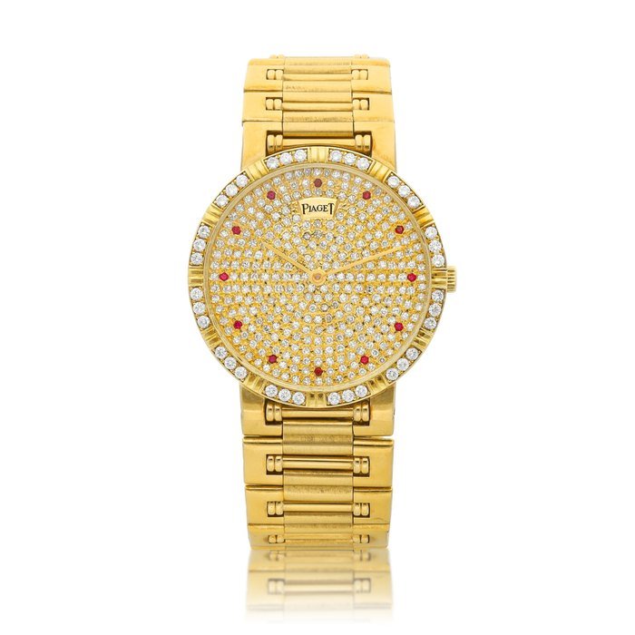 Piaget Dancer, Reference 84024, A yellow gold ruby and diamond-set bracelet watch, Circa 1980 | 伯爵 Dancer 型號84024 黃金鑲紅寶石及鑽石鏈帶腕錶，約1980年製 · 84024