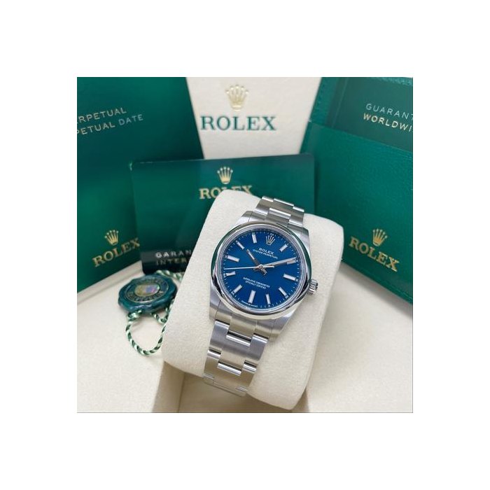 Rolex Oyster PerpetualUnworn Oyster Perpetual 34mm 124200 Stainless Steel Med Blue Index Dial Oyster Bracelet Full Set Unworn Complete Box & Papers