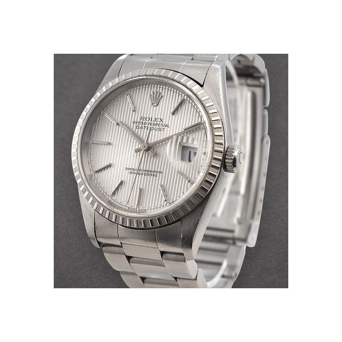 Rolex DatejustMens Datejust 36mm in Steel with White Gold Engine Turned Bezel on Oyster Bracelet with Silver Tapestry Stick Dial Ref. 16220
