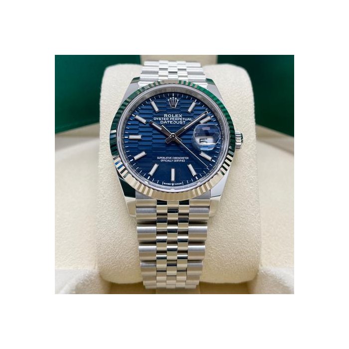 Rolex DatejustUNWORN Datejust 36mm Blue Motif Wave Dial Fluted 126234 Stainless Steel Jubilee Full Set Unworn Complete Box & Papers