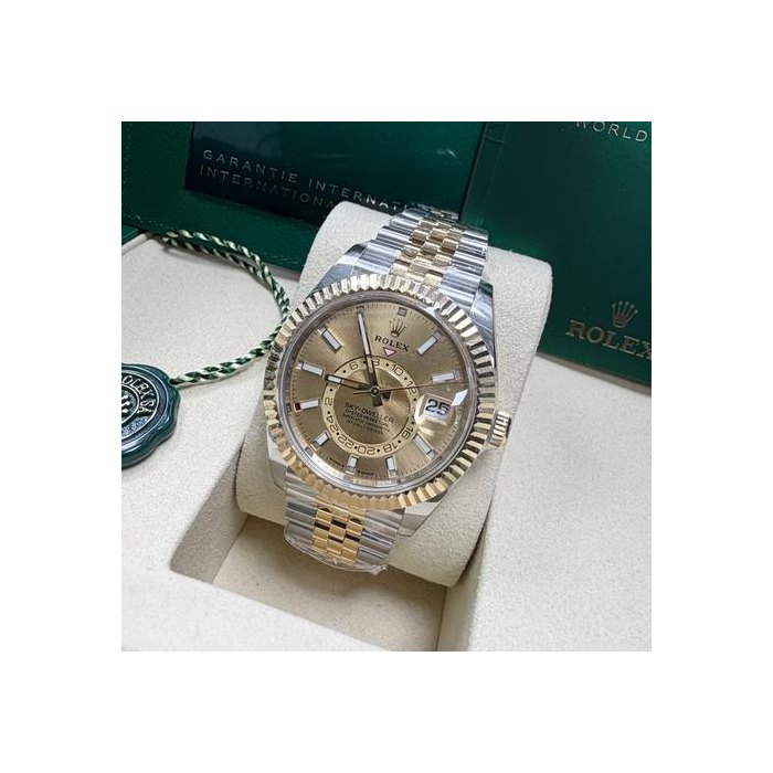 Rolex Sky-Dweller2025 Auto 42mm 336933 Champagne Dial 18K YG Fluted Bezel TT Jubilee B&P Unworn Condition. Complete Full Set.